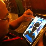 Heubert Khan Michael using an iPad